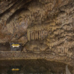 A clever backwards sign was meant to be read as its reflection. A steady drip in the pool made it hard to read.