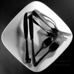 Playing a bit with shadows. This combines 5. Shoot from Above, 8. Pairs, 9. Extreme contrast(studio lighting), 11, Triangular compostiion(studio setup) 25. Make a background, 26. Flashlight, 35. Common object(one light source). I first did a shot without the plate and noticed the curved shadows looked snake like then decided to reshoot on a plate for the bad pun.(My husbands idea). Then I converted to Black and white in post and boosted the contrast. #silverware #shadows #triangle #highcontrast #shotfromabaove #52frames #52project #